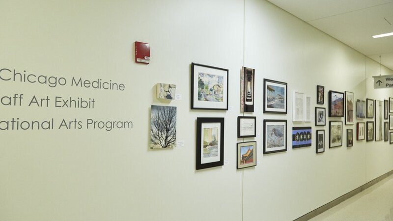 13th Annual Exhibit UChicago corridor lined with artwork from this years exhibit.