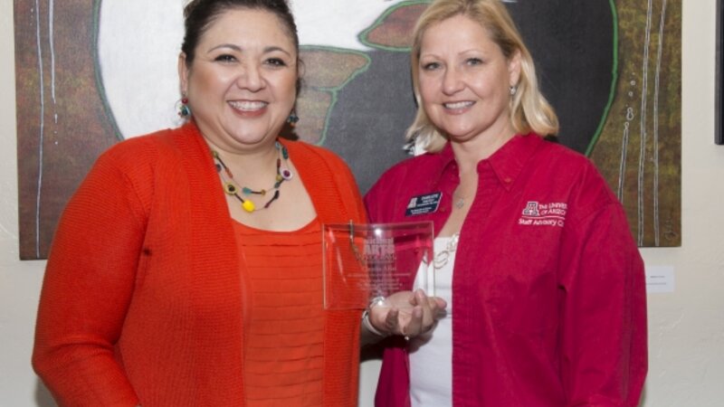 5th Annual Exhibit  On behalf of the NAP, the Executive Vice-President of Staff Advisory Council Charlotte Honeycutt  presented Coordinator Claudia Arias with our 5th Anniversary Award.