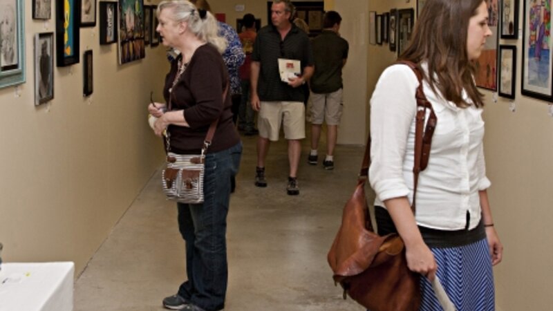 4th Annual Exhibit Attendees taking in the employee artwork on display at the Avera Prairie Center.
