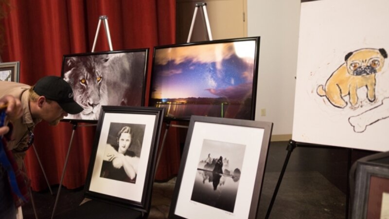 9th Annual Exhibit Reception attendees take a closer look at the award winning artwork at close of event.