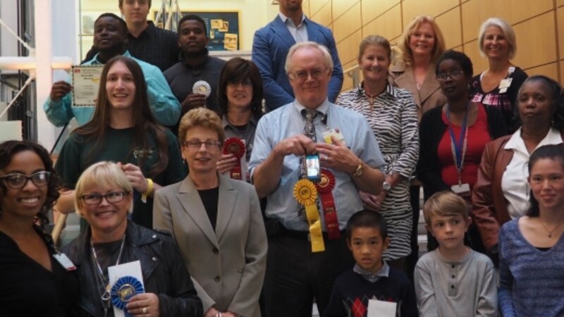 3rd Annual Exhibit 2015 Award Winners pose with presenters and judges at this year's reception.