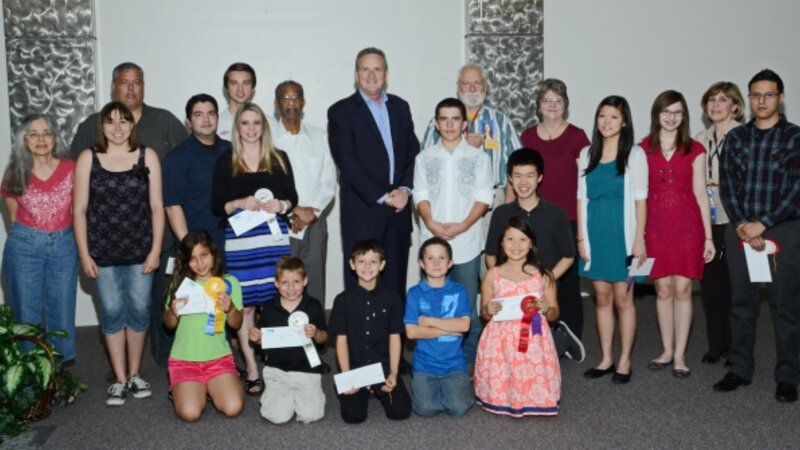 7th Annual Exhibit Award winners posed for a picture with DFW Airport CEO Jeff Fegan at the reception on May 7th.