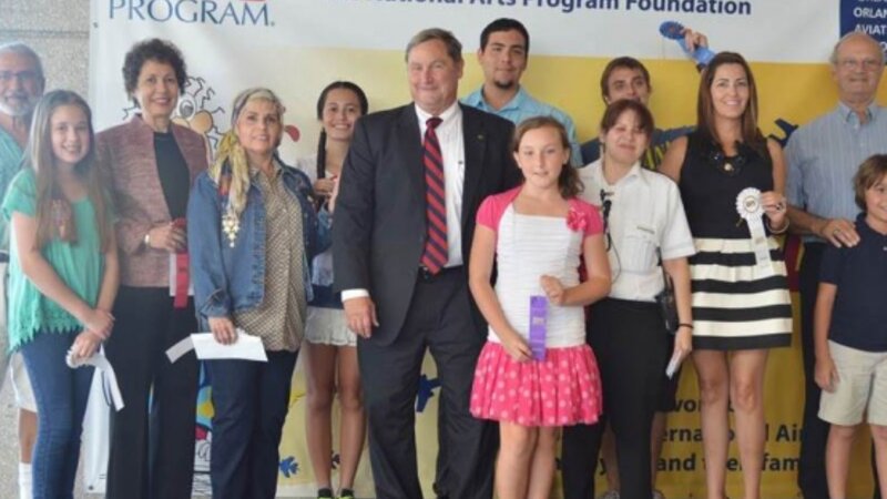 9th Annual Exhibit GOAA Executive Director, Phil Brown, with this year's award winners from Orlando International Airport's NAP awards reception