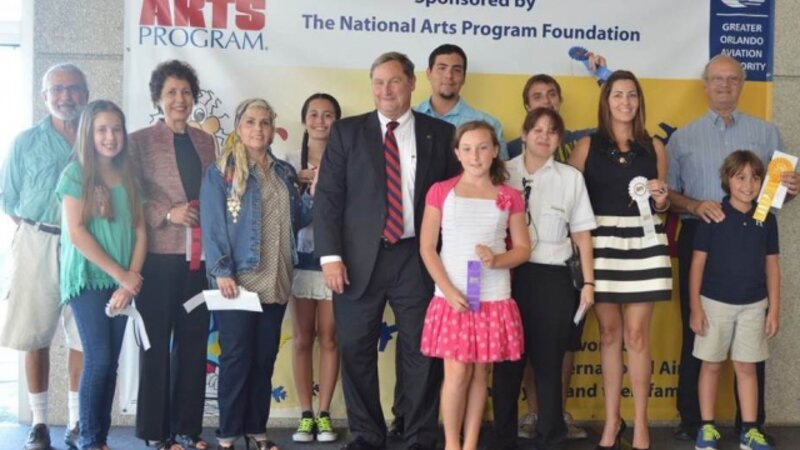9th Annual Exhibit GOAA Executive Director, Phil Brown, with this year's award winners from Orlando International Airport's NAP awards reception