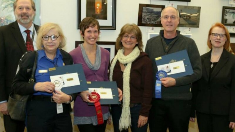 4th Annual Exhibit Adult Professional Winners displaying their awards with Denny Probst, Executive VP of Minneapolis-St. Paul Airport and Sue Gens, Executive Director of the MN State Art Board.