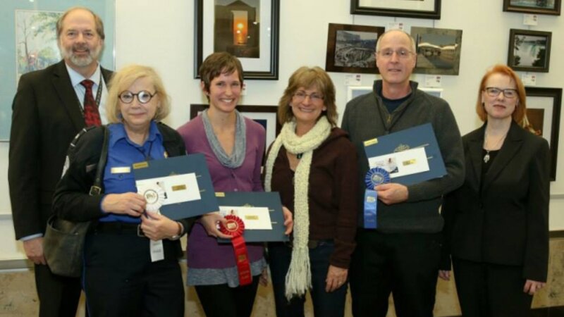 4th Annual Exhibit Adult Professional Winners displaying their awards with Denny Probst, Executive VP of Minneapolis-St. Paul Airport and Sue Gens, Executive Director of the MN State Art Board.