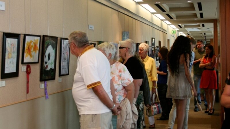 7th Annual Exhibit Attendees taking in the artwork on view at the Aurora Municipal Center
