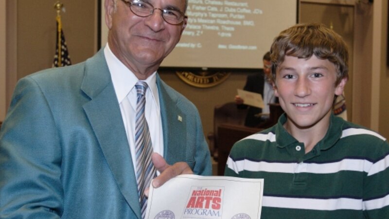 5th Annual Exhibit Ian Krueger accepting his Certificate of Participation
