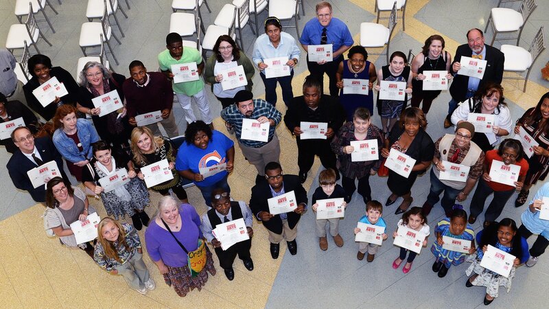 1st Annual Exhibit Award winners proudly displaying their certificates at the reception at the Tubman Museum