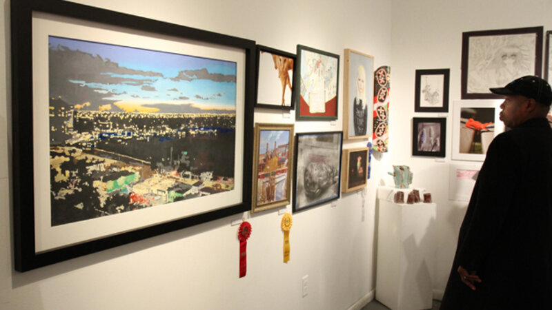 16th Annual Exhibit Admiring all the art on the walls of the Arts Collinswood Gallery