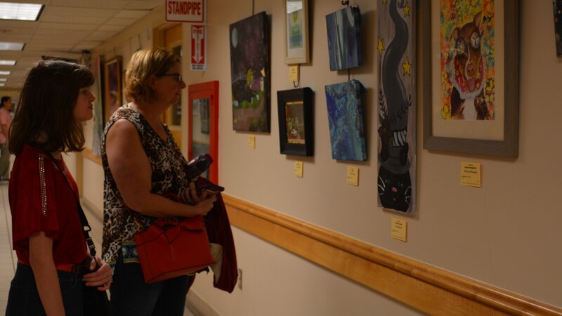 15th Annual Exhibit Attendees taking in the artwork at the Seminole County Services Building