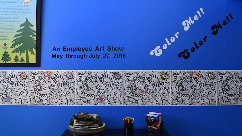 8th Annual Exhibit Coordinator Kim Matthews invited visitors to the exhibition to get involved by including a coloring wall in the gallery.