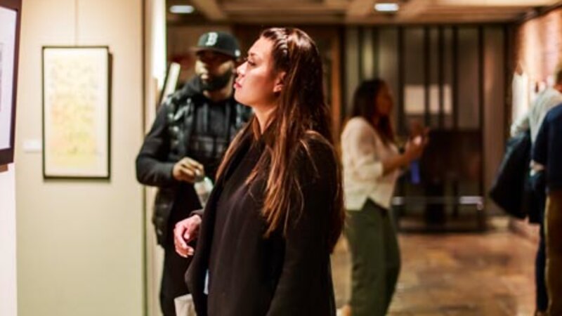 3rd Annual Exhibit Attendees taking in the winning artwork at this year's City of Boston exhibit