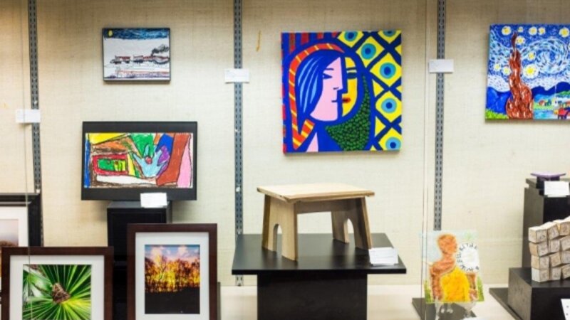 5th Annual Exhibit One of the beautiful glass cases featuring some of the colorful artwork from this year's show.