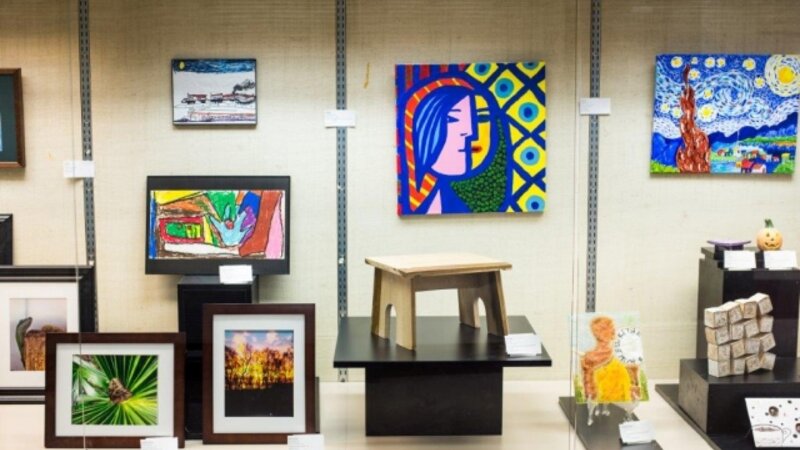 5th Annual Exhibit One of the beautiful glass cases featuring some of the colorful artwork from this year's show.