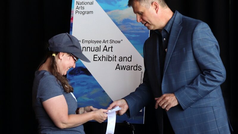 13th Annual Exhibit Karen Inda Accepting Award from RTAA CEO Daren Griffin