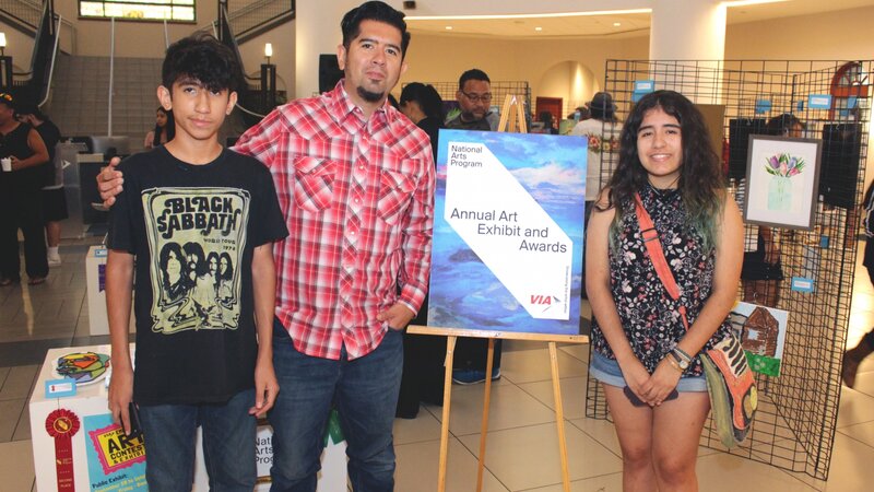 9th Annual Exhibit VIA employee Raul Pena poses with his children, Dean and Madison, who have all been participating artists in the NAP exhibit three years running.