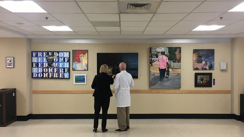 14th Annual Exhibit VCU staff pausing to take in the talents of their fellow employees.