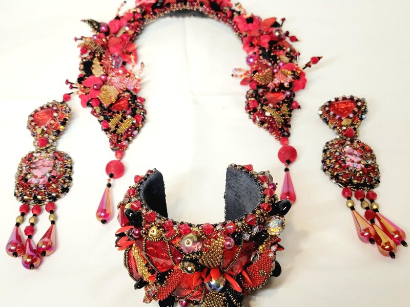 Jewelry set: necklace, bracelet, earrings with various beads and crystals.