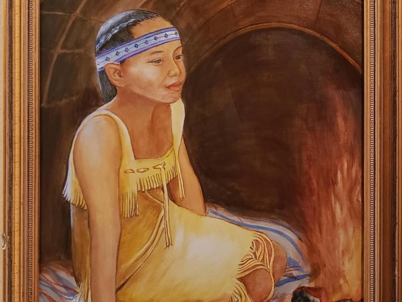 Beautiful Tribal Young Woman dreams by the fire in her Wetu