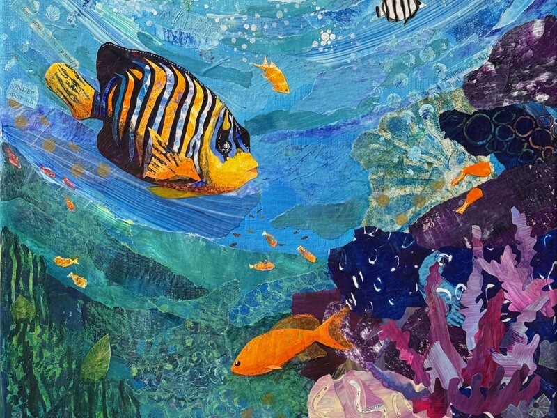 Mixed media torn-paper collage of multiple tropical fish swimming among coral