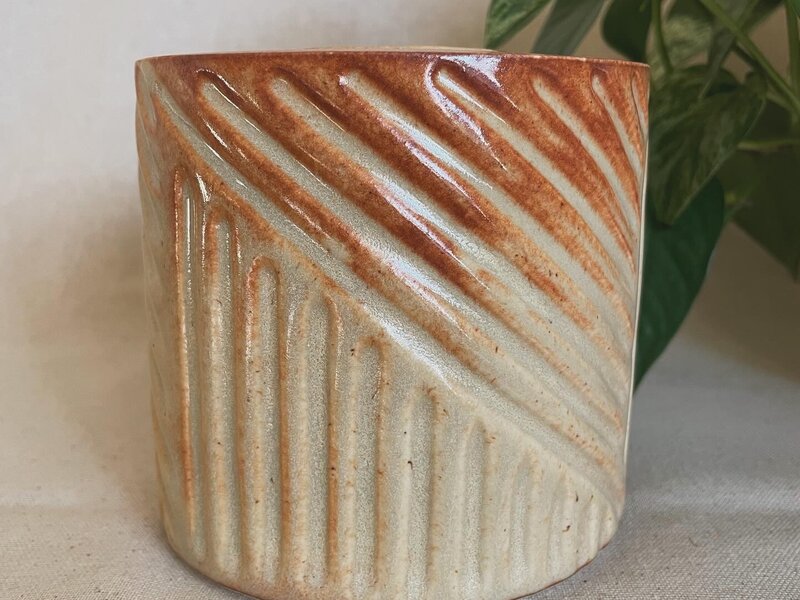 Carved ceramic vessel. 
