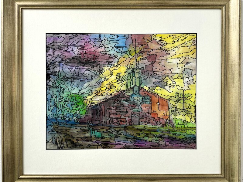 church backlit by colorful sunset 