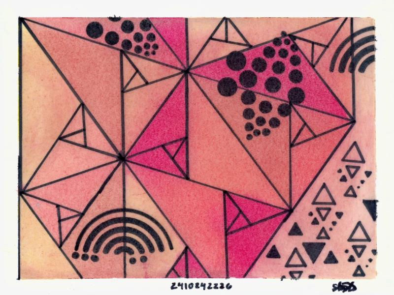 Geometric design of triangles and circles, on a paper, with red, yellow, and orange coloring. 