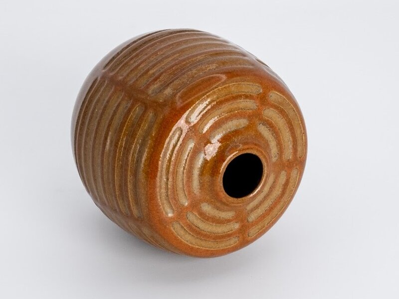 Carved stoneware vessel