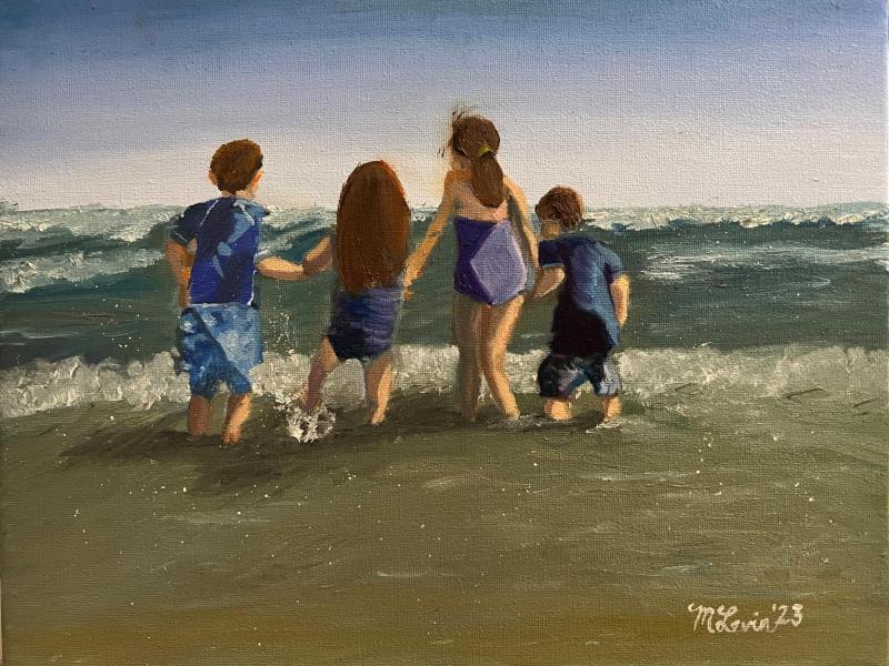 Four children on beach holding hands as the shallow ocean waves splash at their feet.