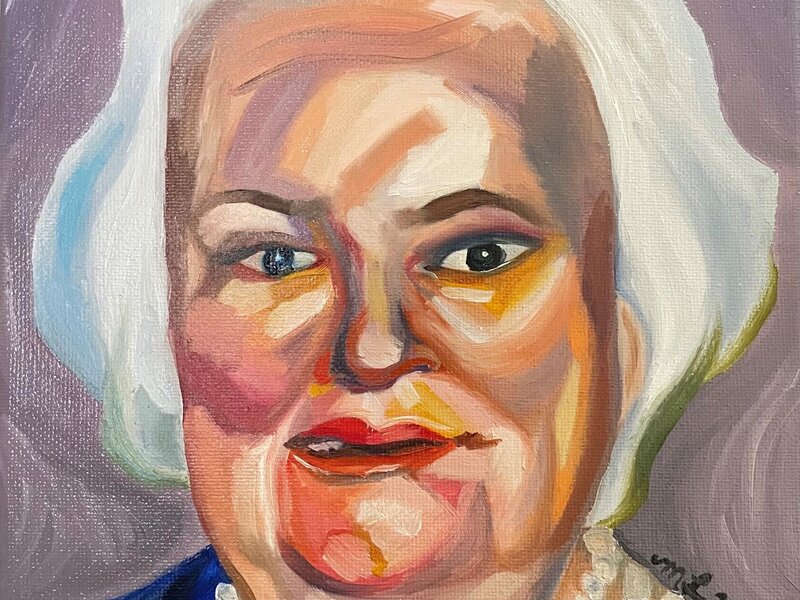 Loose saturated portrait of old woman sporting a white bob and pearls