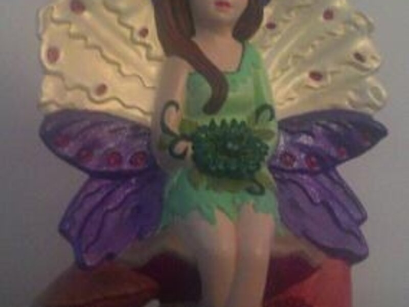 Fairy Seated on Mushrooms