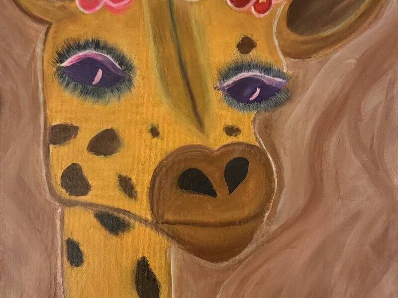 a giraffe with flowers