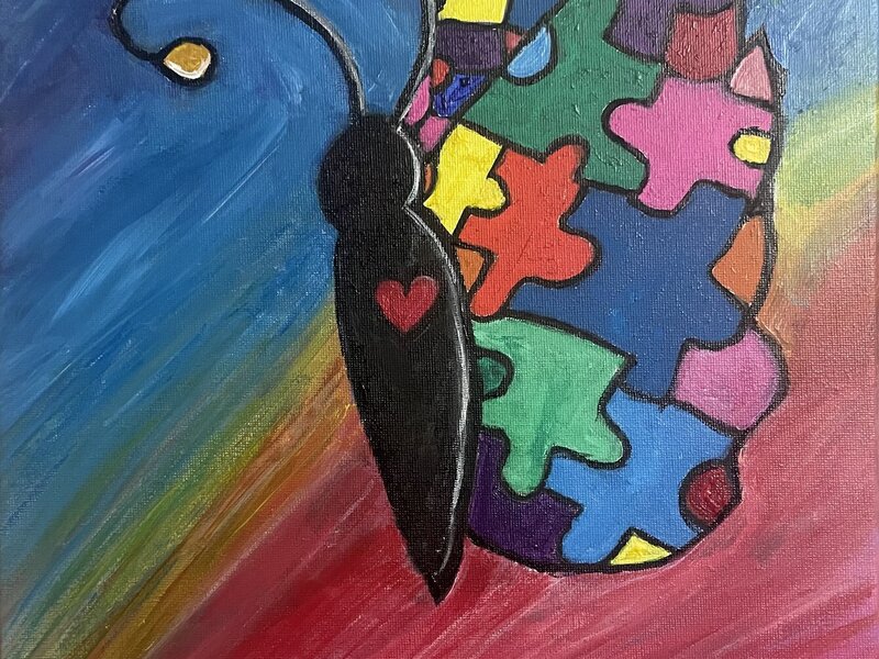 butterfly with multiple color puzzle pieces