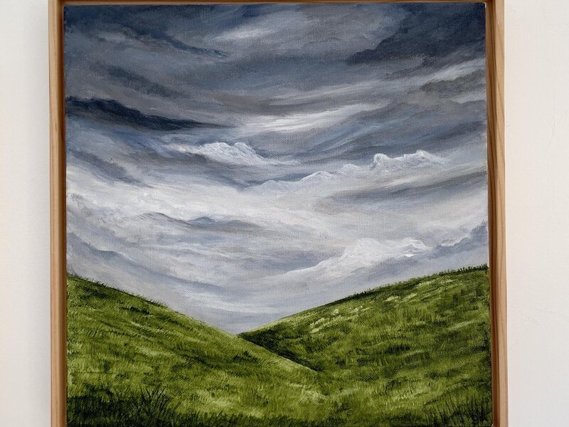 Moody sky and rolling hills