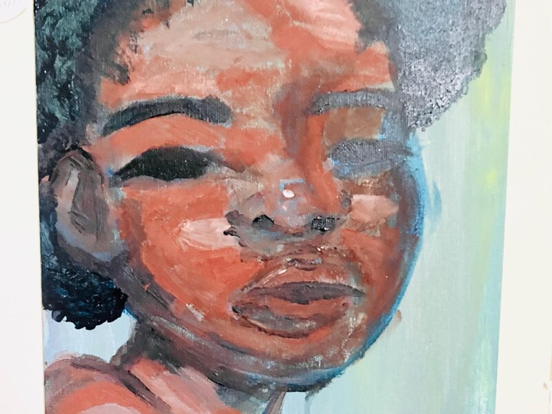 painted black woman with a curly afro