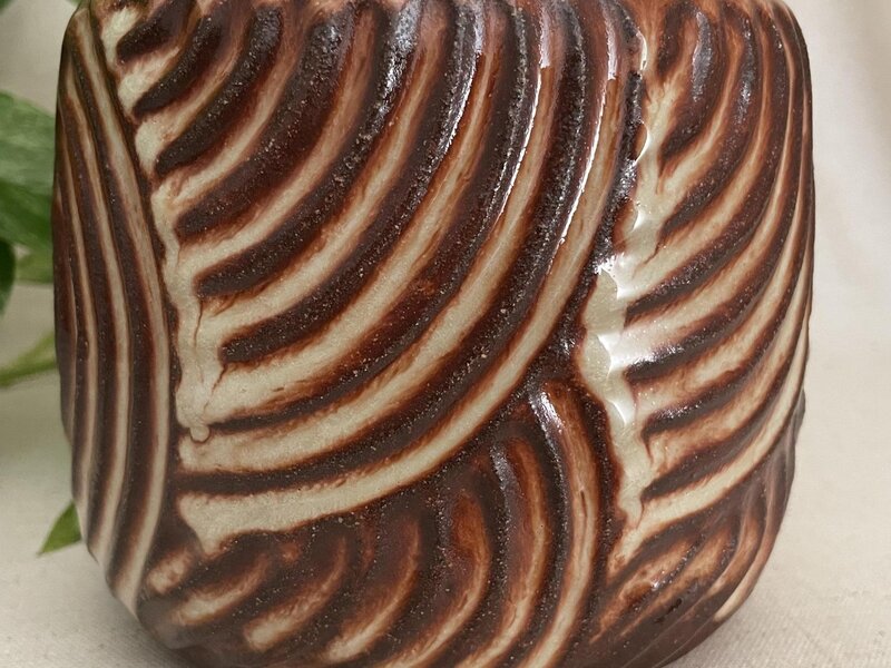 Carved ceramic vessel. 