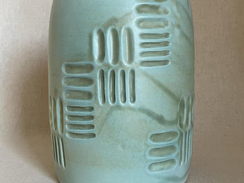Carved ceramic vessel. 
