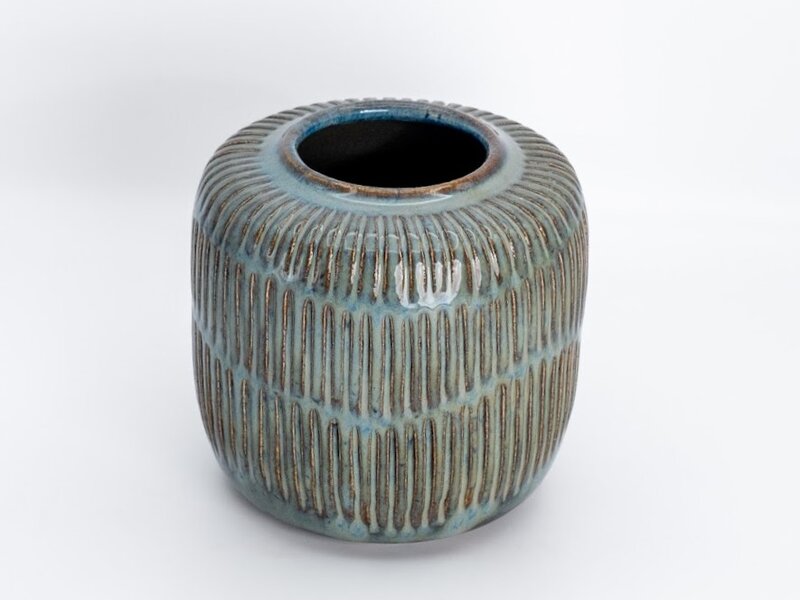 Carved stoneware vessel