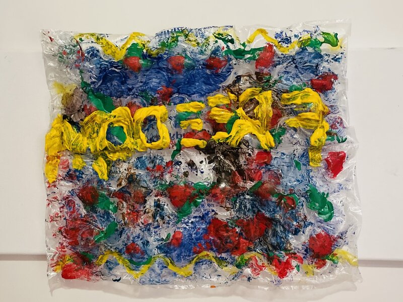 Quilt made of recycled plastic and acrylic paint.