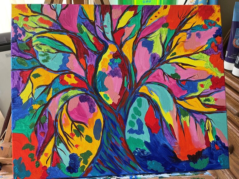 Multicolor tree with tree branches all coming out of the trunk.