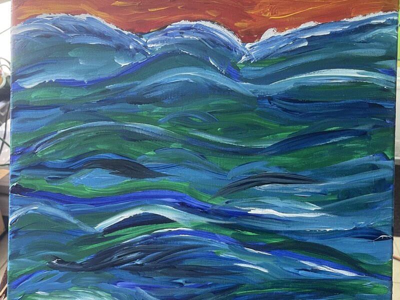 Wild waves with an orange red sky