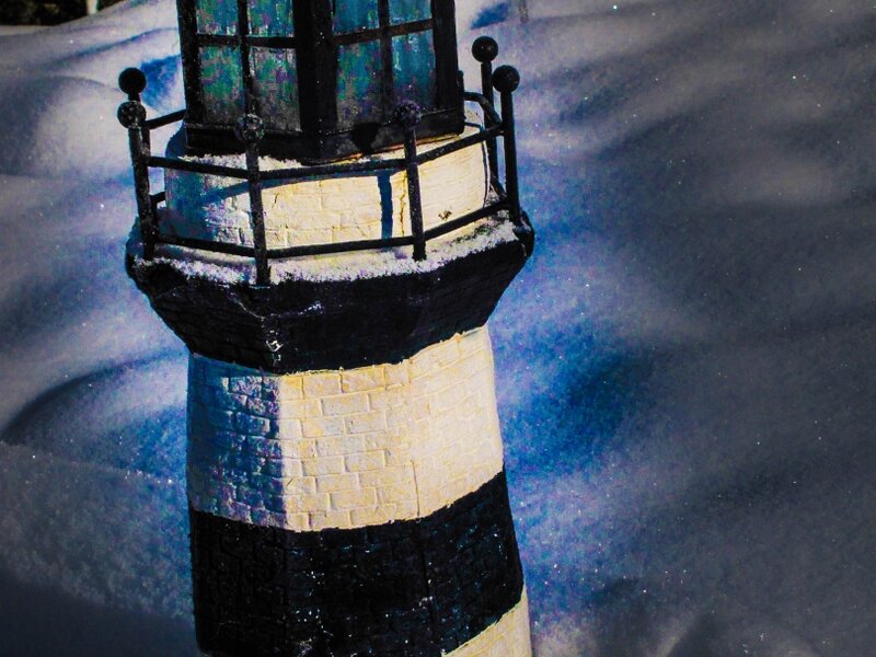 lighthouse in April snow
