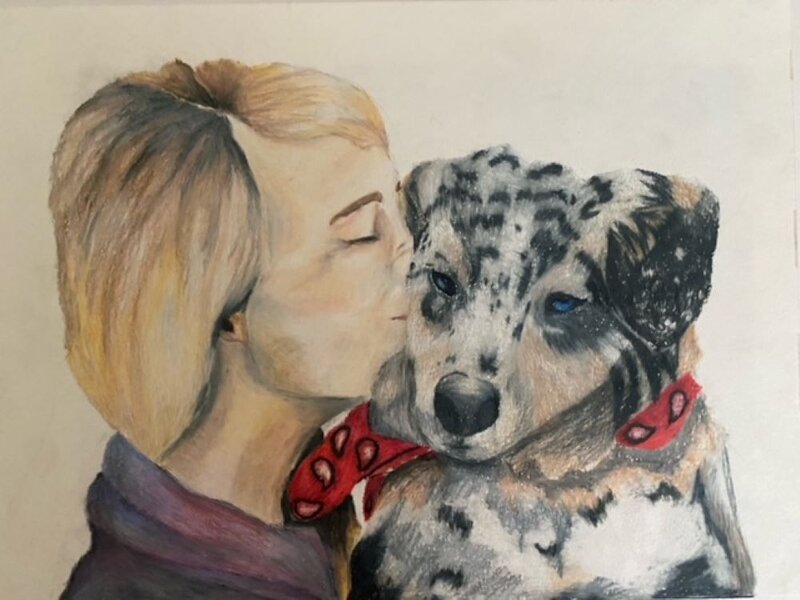 a woman with her puppy