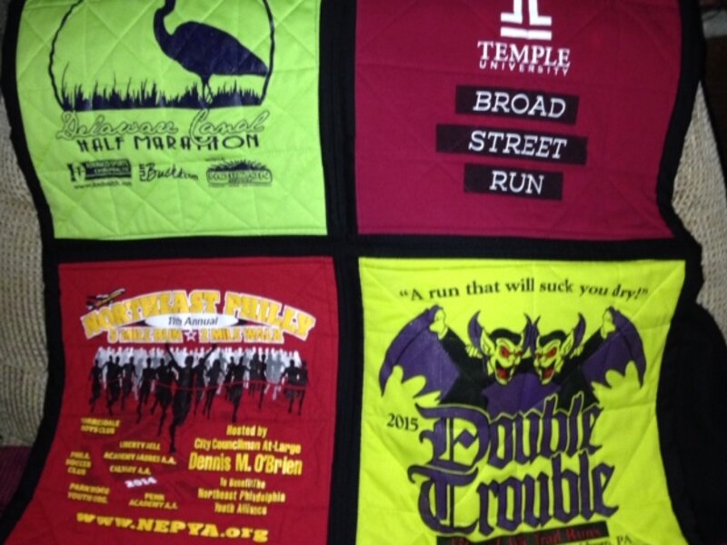 picture of four square quilt with black binding. intended to have stained glass appearance