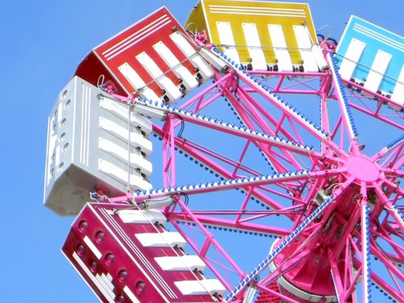 image: photo of a colorful amusement ride title:spin 