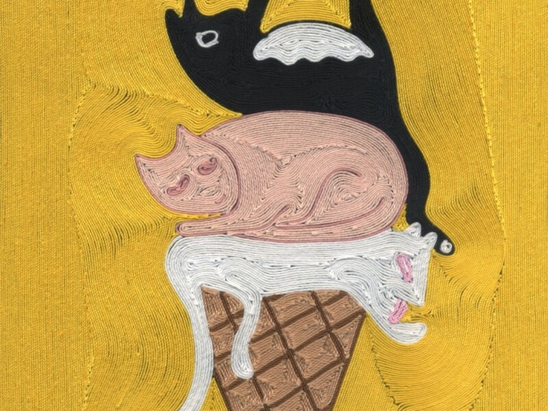 Three cats on top of an ice cream cone, as if scoops of ice cream