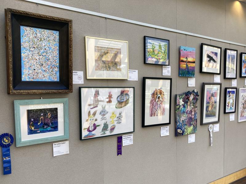 A wall filled with artwork from the 20th Annual Santa Rosa, CA National Arts Program!