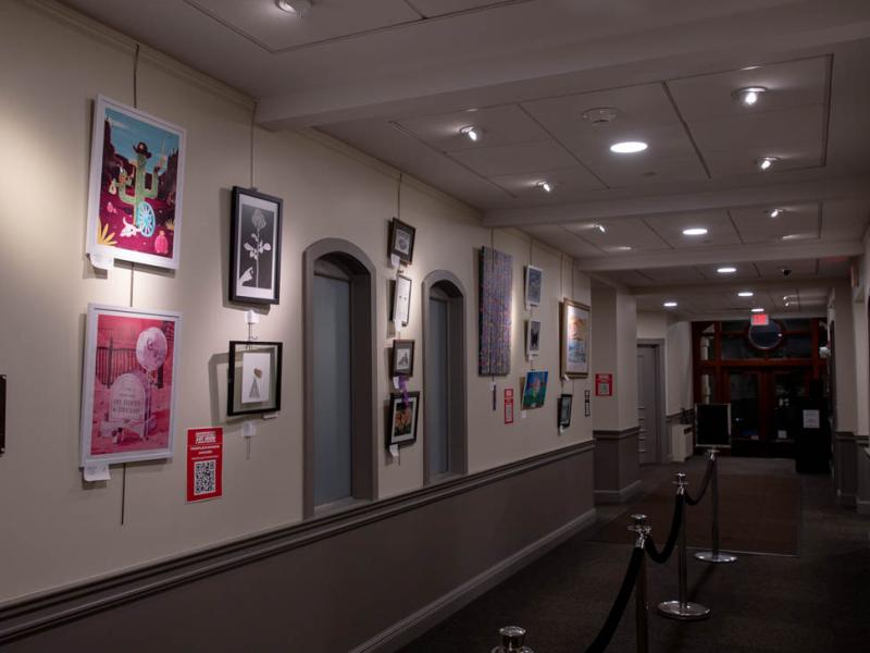 Hallway filled with artworks from the 15th Annual Show
