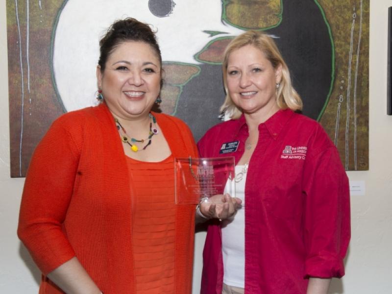 5th Annual Exhibit  On behalf of the NAP, the Executive Vice-President of Staff Advisory Council Charlotte Honeycutt  presented Coordinator Claudia Arias with our 5th Anniversary Award.
